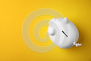 White piggy bank on color background
