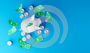 White piggy bank with falling dollar bills and coins on blue background