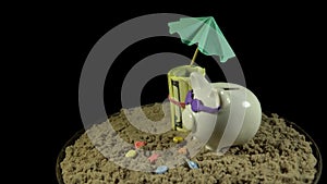 A white piggy bank stands on a sandy beach and revolves on a black background.