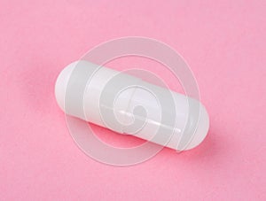 White Pill on Pink Background
