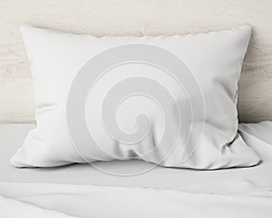 White pillow on the bed, background