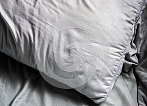 White pillow and bedsheets