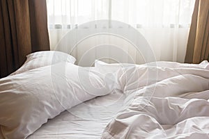 white pillow and blanket with wrinkle messy on bed in bedroom, m