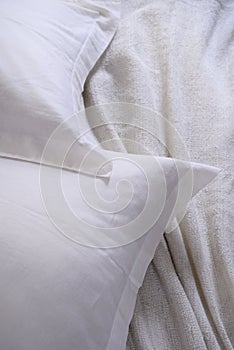 White pillow messy bed