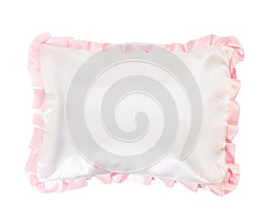 White pillow with a pink frill