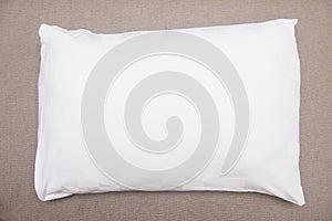 White pillow on sofa