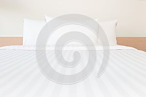 White pillow and white bed in bed room