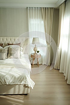 White pillows setting on English country style bedding