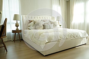 White pillows setting on English country style bedding