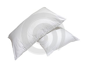 White pillows in stack in hotel or resort room isolated on white background with clipping path. Concept of confortable and happy photo