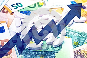 White pills on the background of euro bills.