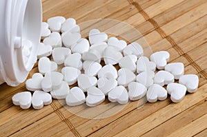 White pills in the form of heart