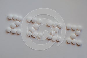 White pills spelling out ZZZZ on white background .concept insomnia ,Melatonin to help sleep