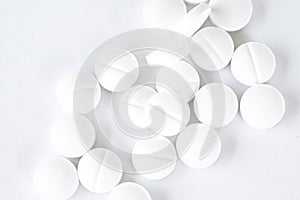 White pills on white