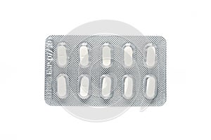 White pils tablets in blister pack isolated on white background.