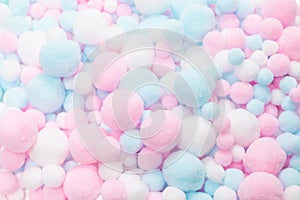 White, pink and blue soft pompons