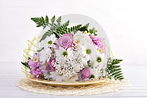 White and pink bouquet on table