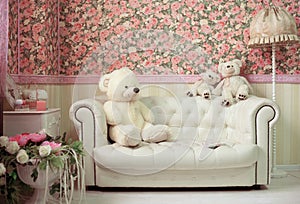 White and pink cozy room with flowers teddy bears white sofa and lamp
