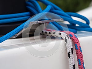 White and pink lines and blue tangle on sailing boat