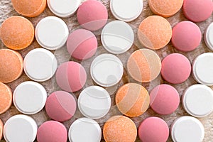 White, pink and orange tablets stripes background. Different Ant