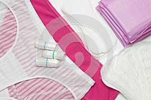 White and pink pants. Woman hygiene protection, menstruation sanitary pad and cotton tampons. Protection for woman critical days,