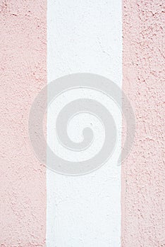 White pink purple purple wall, concrete background, vertical stripes. Half-colored strip, two-color and three-color texture