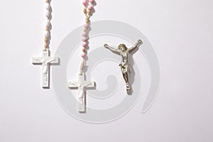 Two rosaries and a crucifix horizontal