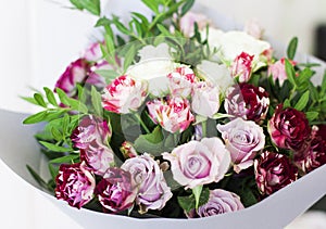 The white and pink spray roses in gray floral paper