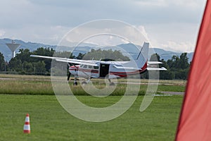 White Piper Aircraft with Open Tailgate and Parachutist inside: Parachuting Training