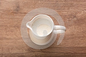 White pitcher with milk