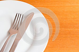 White place setting on wooden table