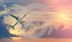 White plane in cloudy sky