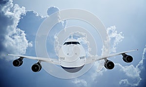 White plane flying in sky and clouds. Airplane boeing 747