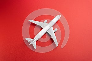 White plane on a red background. Airline operators, air carriers.