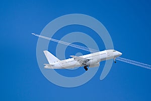 white plane taking off and airplane flying above and behind in clear blue sky with white condensation trails