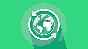 White Planet earth and a recycling icon isolated on green background. Environmental concept. 4K Video motion graphic