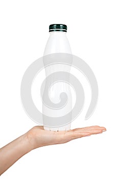 White plastic bottle with drink yogurt or milk with hand. Isolated on white background. Container merchandise template