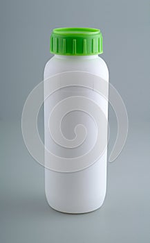 White plastic bottle mockup with green cap