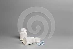 White plastic bottles of medicine and pills