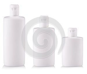 White Plastic bottles with soap or shampoo without label reflected on white background