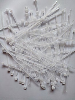 White plastic cable ties isolated on a white background