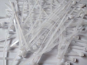 White plastic cable ties isolated on a white background