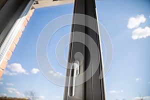 White plastic double glazing window and bright blue sky background