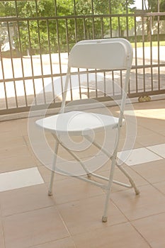 White plastic folding chair