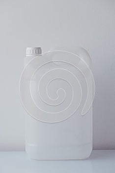 White plastic jerrycan canister for chemical liquids