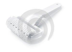 White plastic lattice dough cutter