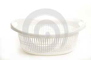 White plastic laundry basket