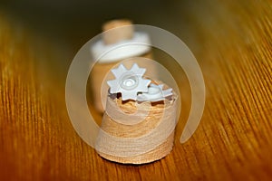 White plastic made objects with wood background photograph.