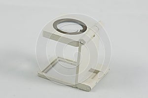 White plastic magnifying glass