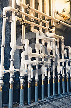 White plastic pipes in boiler room